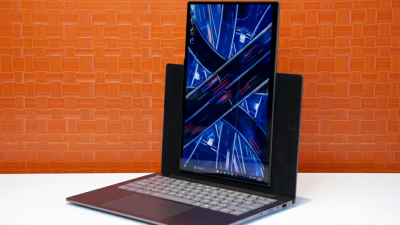 Lenovo ThinkBook VertiFlex Concept laptop showing vertical screen mode on a desk.