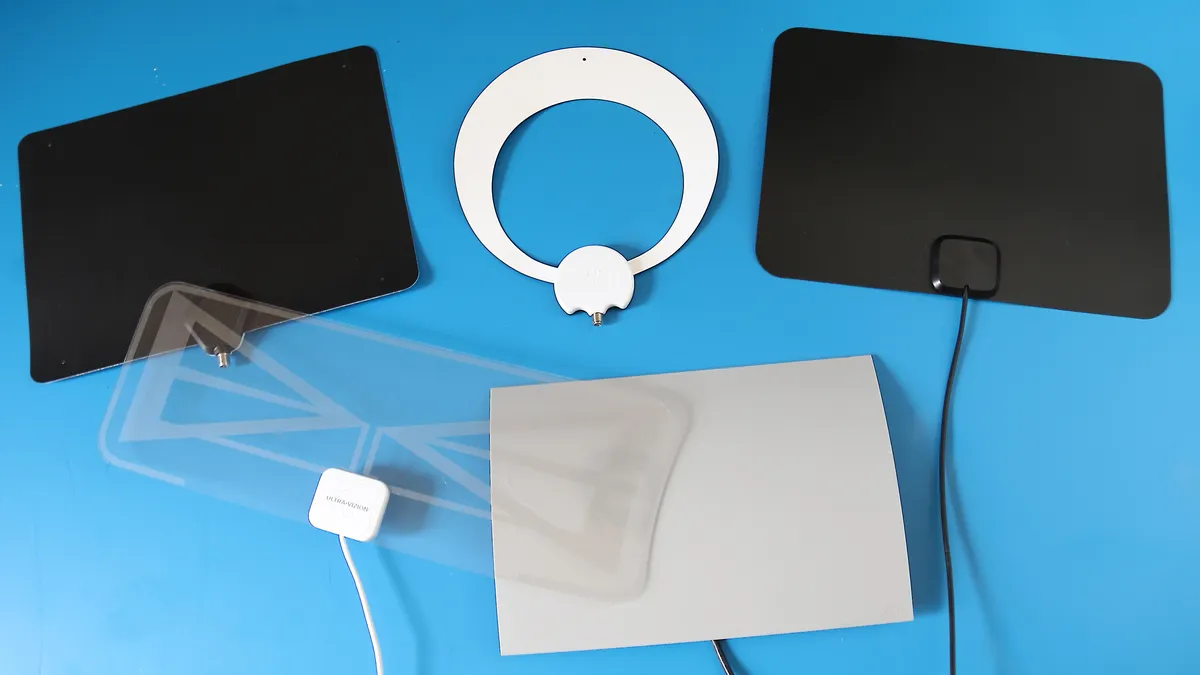Modern living room with a sleek TV antenna connected to a television, symbolizing cord-cutting.