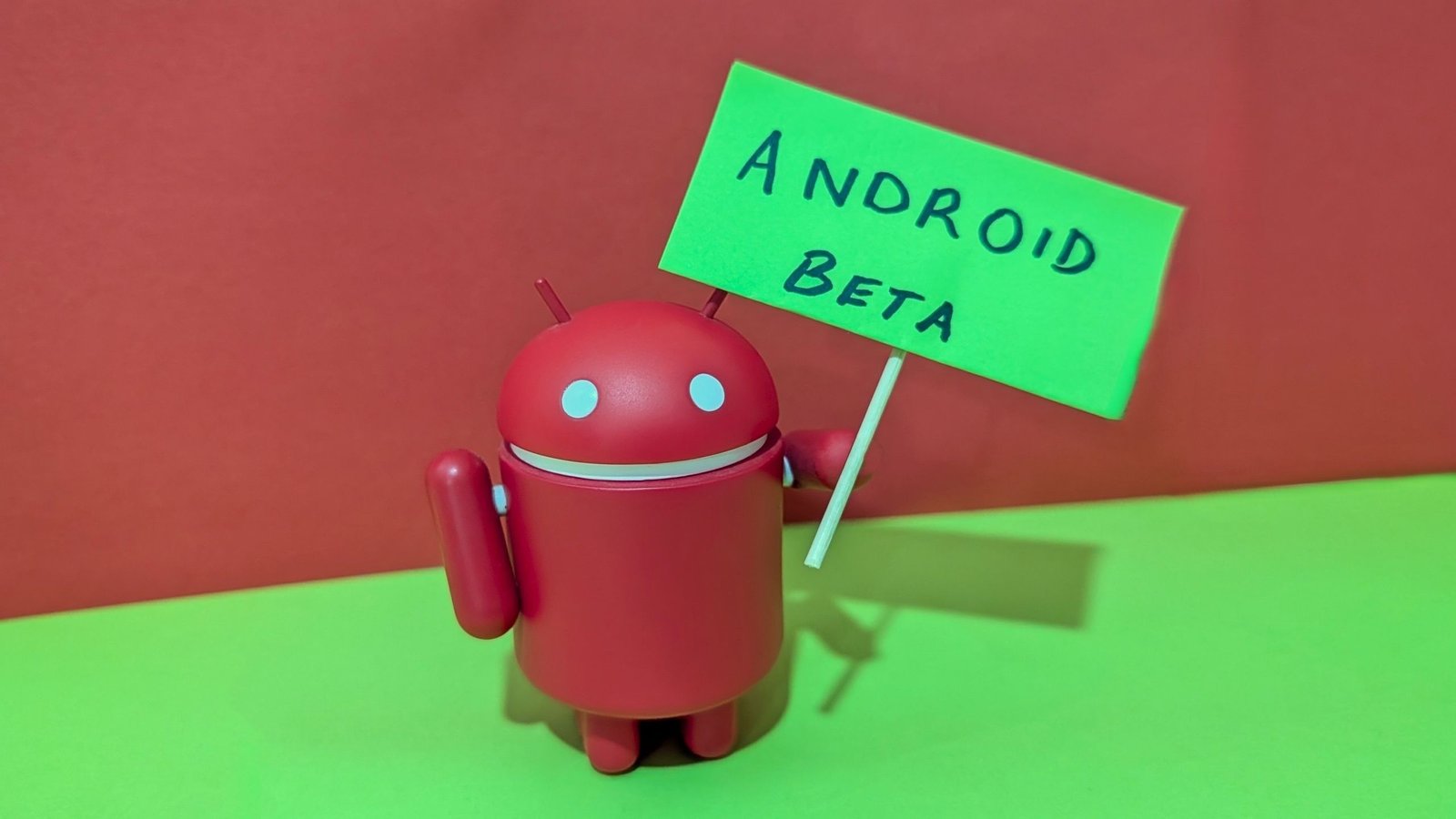 Person holding an Android phone with a concerned expression, symbolizing frustration with beta software glitches.