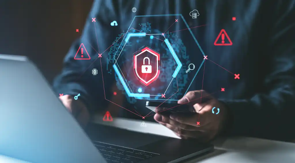 IT professional using autonomous endpoint management software on a laptop, symbolizing innovation and efficiency.