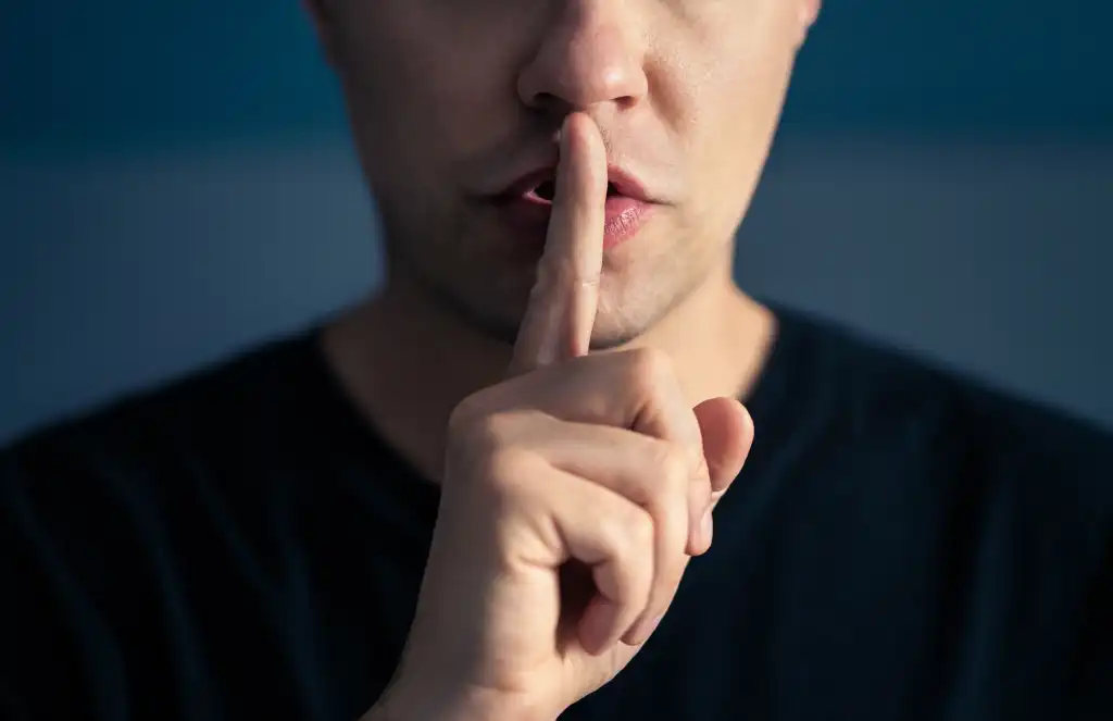 Employee looking concerned while presenting data to a board of directors, symbolizing shadow AI and employee silence.