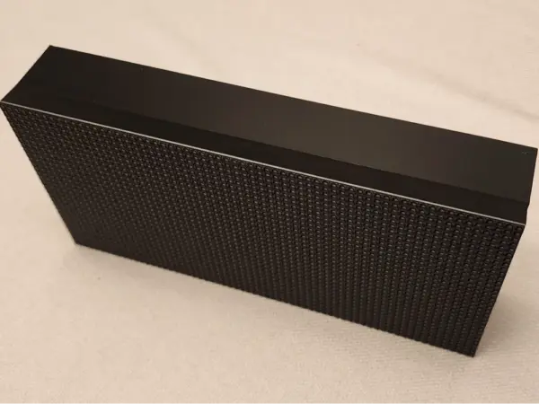 3D printed enclosure for Adafruit LED matrix displaying a vibrant pattern