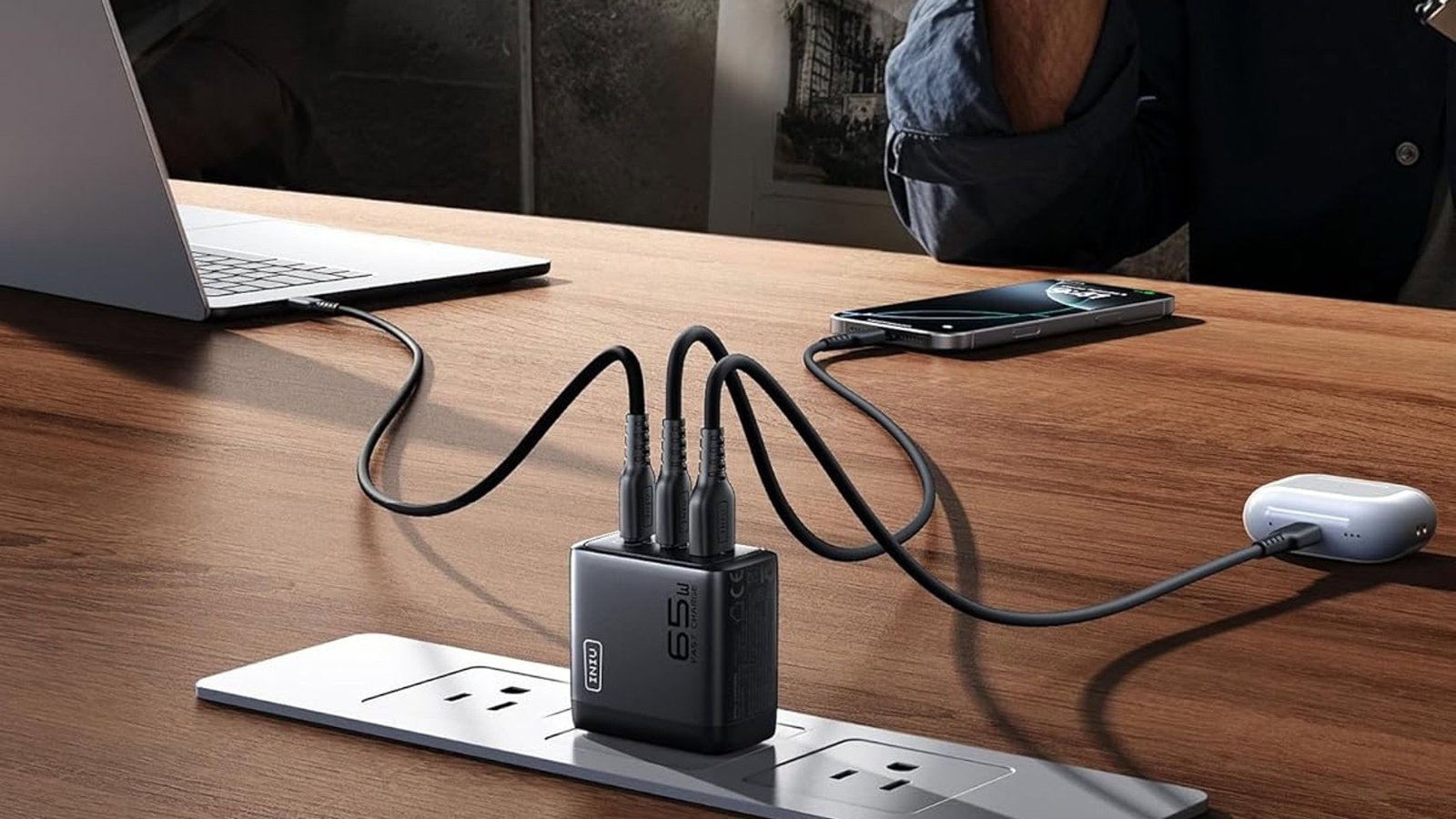 INIU 65W GaN charger on a white background, highlighting its compact size and the Prime Day deal.