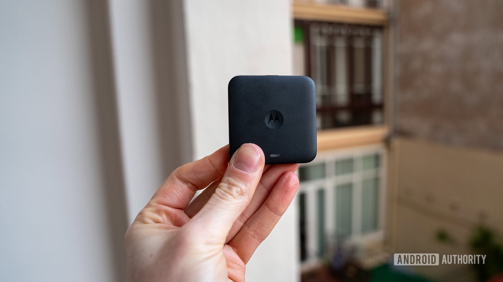 Motorola MA2 Android Auto adapter with a blurred background, indicating a product image.