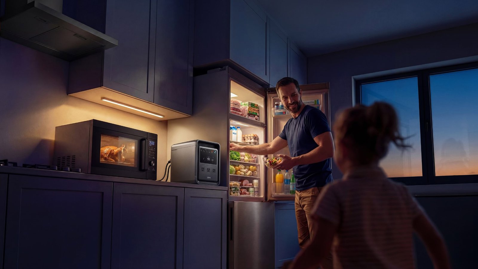 Anker SOLIX S2000 portable power station with a refrigerator plugged in.