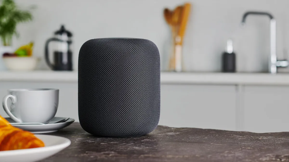Collage of various Apple HomeKit devices including smart lights, thermostats, and speakers, with the year 2026 subtly integrated.