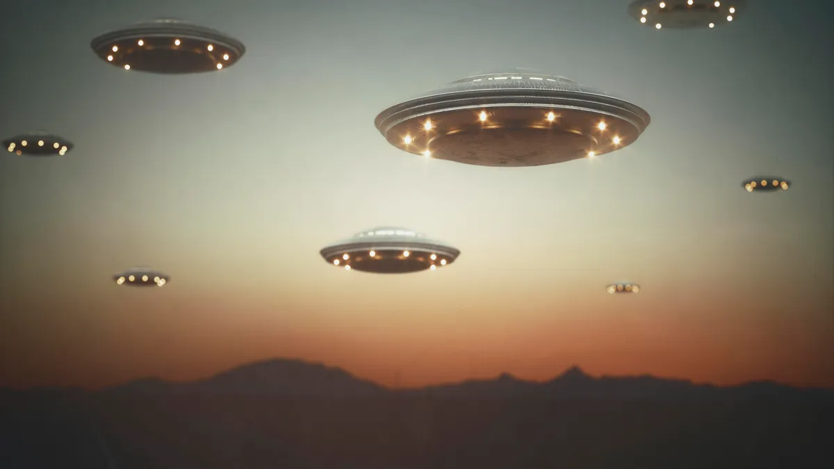 A blurry, indistinct image of a supposed UFO in the sky, with a question mark superimposed.