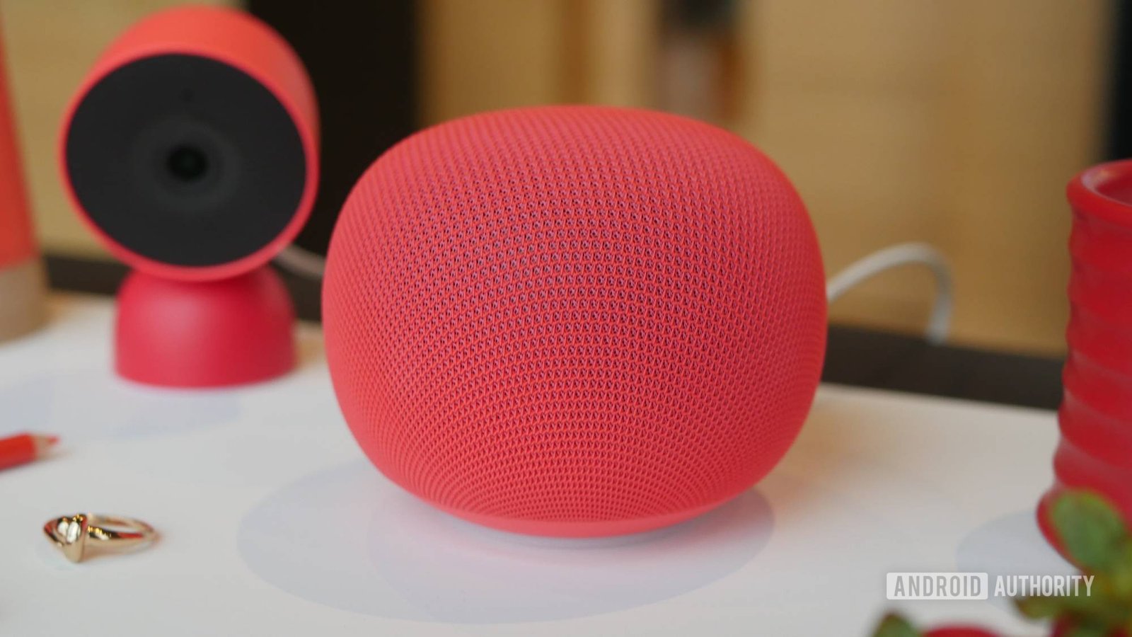 Google Nest Audio speaker next to a new Google Home speaker