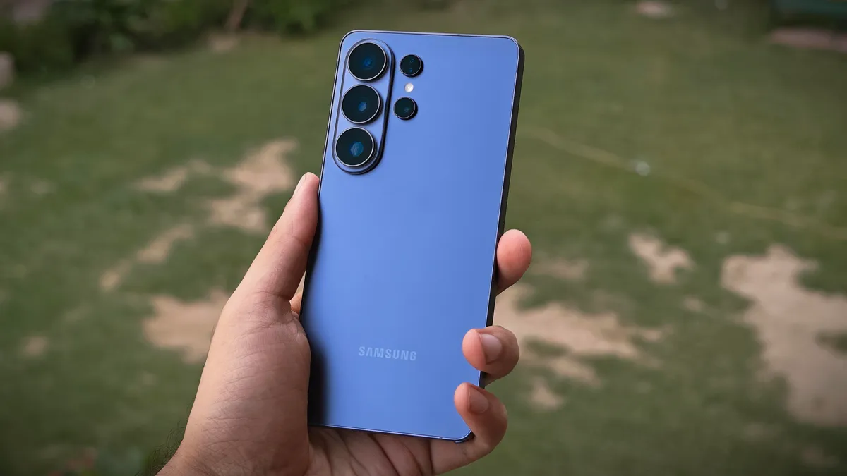 Close-up of a Samsung Galaxy S26 Ultra camera lens with a cityscape blurred in the background.