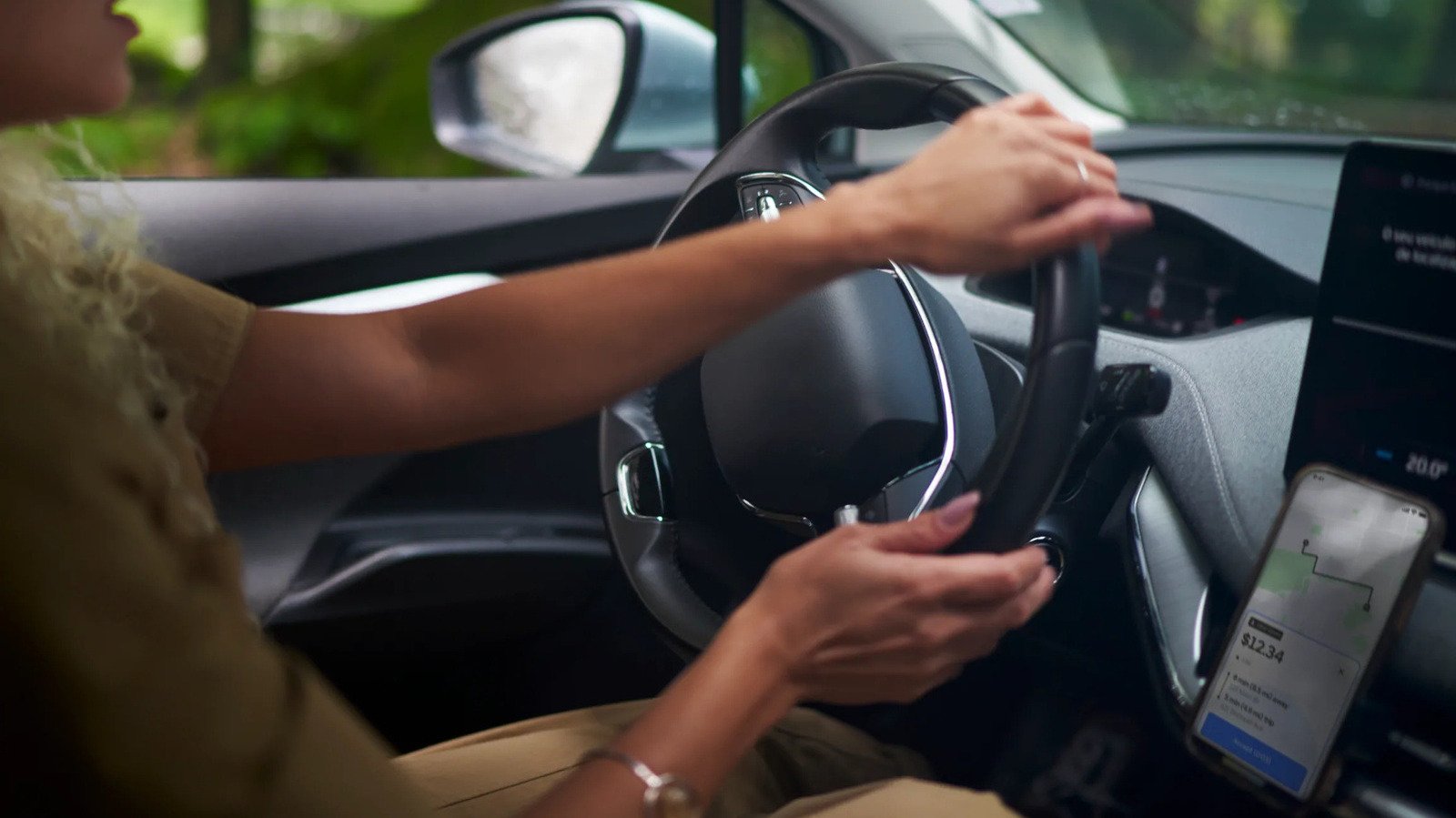 Uber driver with a car, representing Uber background checks for drivers.
