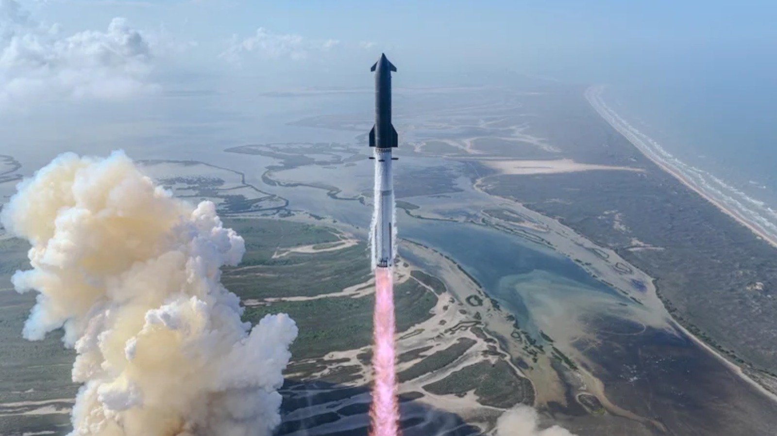 SpaceX Starship rocket on launchpad with SpaceX natural gas pipeline infrastructure in the background.