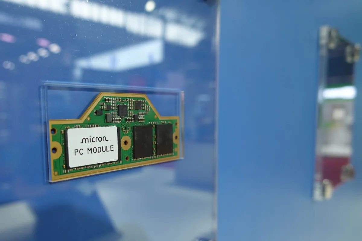 Micron Technology logo with stock market charts in the background, symbolizing its potential rise alongside Nvidia.
