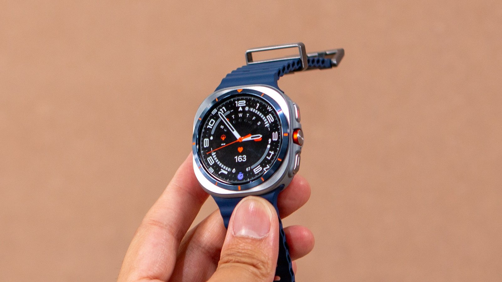 Samsung Galaxy Watch Ultra on a table with a blurred background, highlighting its premium design.