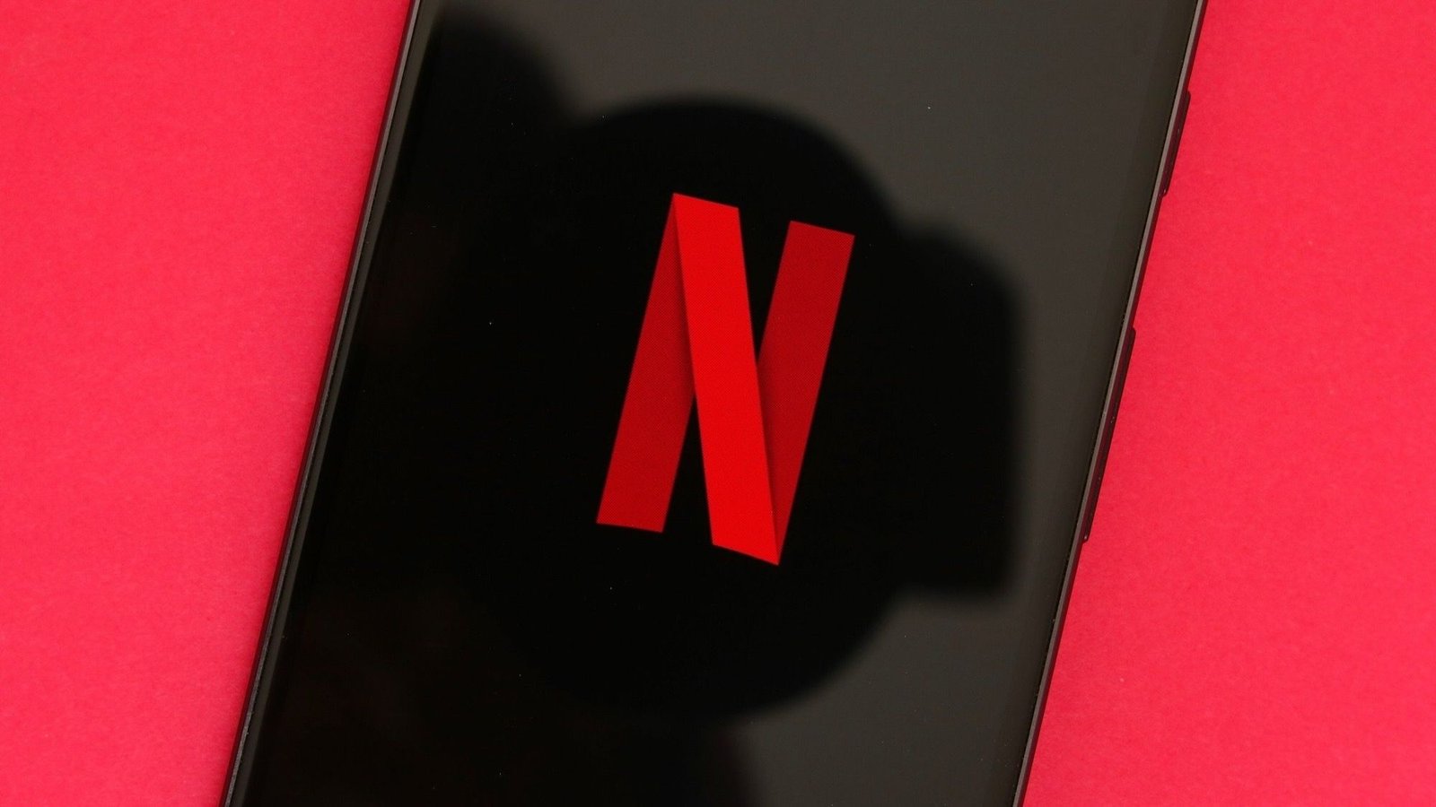Illustration of a Netflix profile screen with multiple user icons, each with a distinct email address displayed.