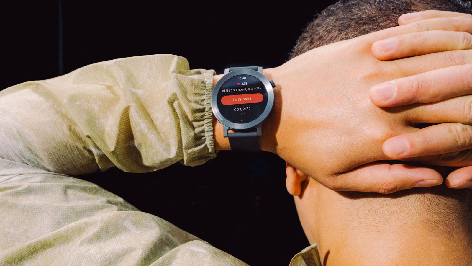 A budget smartwatch displaying a notification, with a blurred background suggesting a sale.